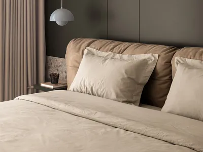 A well-designed minimalist bedroom with a fabric bed and wood accents.