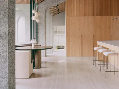 A modern kitchen featuring wooden beams on the ceiling and walls.