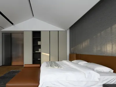 A modern minimalist bedroom with a white bed and brown leather bench, featuring a white bookshelf and a gray wall.