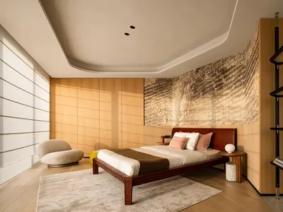 A modern bedroom featuring minimalist furniture and a wooden headboard with a fabric bedspread.