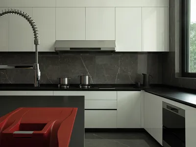 Modern kitchen featuring sleek metal appliances and marble countertops.