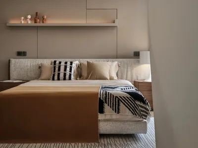 Modern minimalist bedroom with neutral-toned textiles, wood, and matte-finish metal.