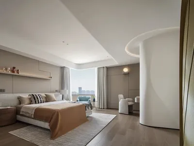 Modern minimalist bedroom featuring a large bed with neutral-colored bedding, a simple nightstand, and a floor-to-ceiling win