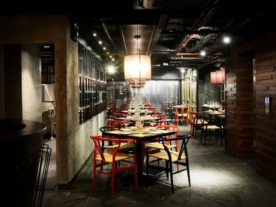 Industrial-style restaurant interior with wooden and metallic elements