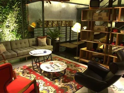 Modern industrial living room featuring concrete and wooden elements