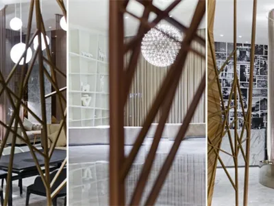 A modern hotel lobby featuring metallic structural elements and contemporary design.