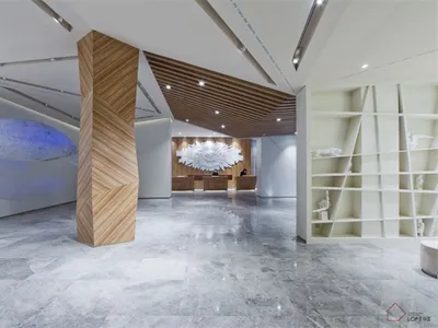 Modern designed hotel lobby featuring concrete walls and flooring.