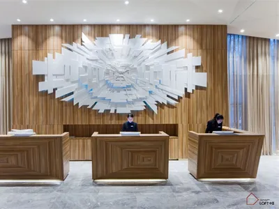 Modern hotel reception counter with a wooden design.
