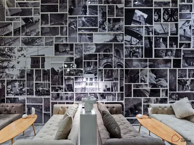A modern interior space with black and white photographs on the wall.