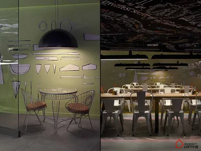 A modern restaurant interior featuring metal chairs, glass elements, and a wooden dining table.