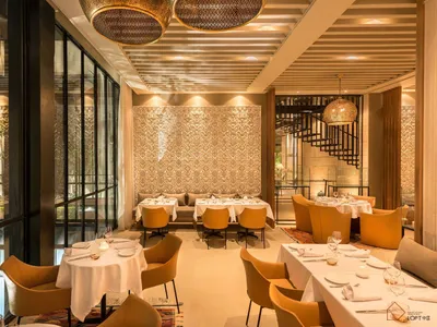 Modern interior of a restaurant featuring metal and lighting design.