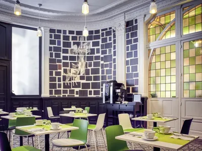 A modern restaurant interior with acrylic and green accents.