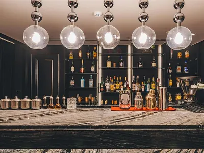 A luxurious industrial-style bar counter made of marble.