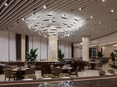 Modern, minimalist restaurant interior with contemporary design elements, featuring clean lines, high ceilings, and sleek fur