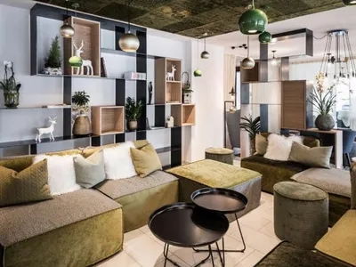 A modern industrial living room with a mix of mixed flooring materials.