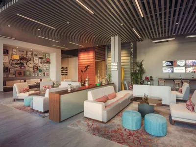 Industrial-style lounge space with concrete flooring and fabric seating.