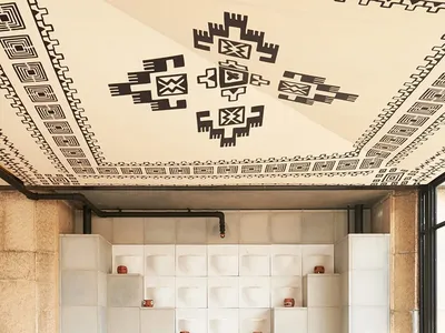 A modern industrial restaurant interior featuring concrete walls and minimalist design.