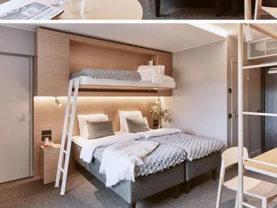 Modern bedroom featuring a unique floating bunk bed design, with a combination of grey beds, minimalistic wooden furniture, a