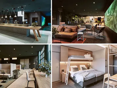Modern hotel lounge area with a contemporary design featuring a large wooden reception desk and comfortable seating areas wit