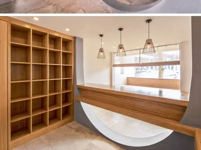 Lobby area of a modern restaurant with concrete materials and minimalist design