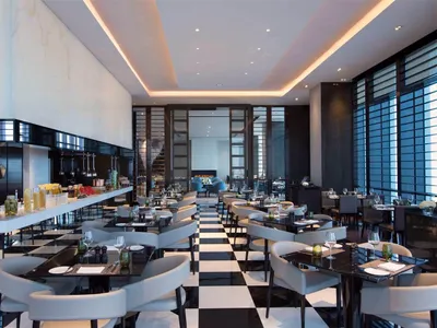 Modern restaurant interior with glass and marble materials