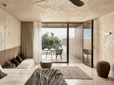 Modern minimalist bedroom with concrete walls, floor, and ceiling.