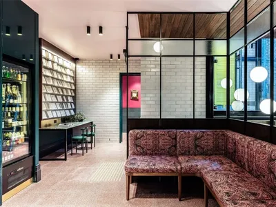 A design image of a modern restaurant featuring tiled flooring and white brick walls.