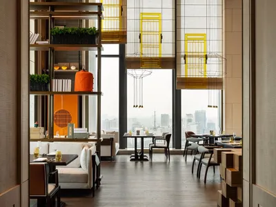 Modern interior design of a restaurant with contemporary furniture and minimalistic decor.