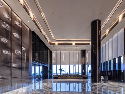 Modern hotel lobby featuring metallic bamboo accents and minimalist design.