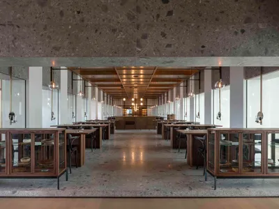 Modern restaurant interior designed with contemporary concrete elements.