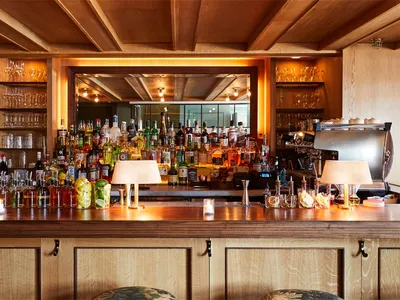 A photograph of a wooden-panelled restaurant bar.
