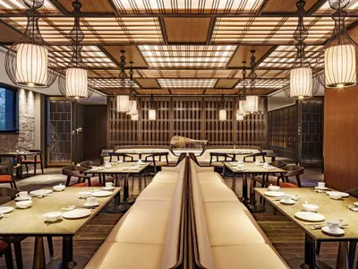 Modern restaurant interior featuring wooden and metallic elements.