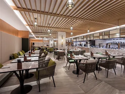 Contemporary restaurant interior with marble finishes and modern seating arrangements.