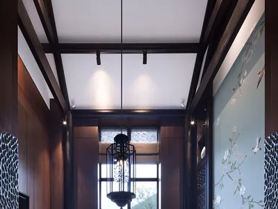 An elegant dining room featuring Asian-inspired decor with wooden furnishings, glass chandelier, and fabric seating.