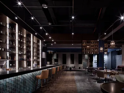 A modern bar featuring metallic elements and sleek design.