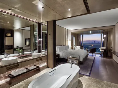 Modern, luxurious hotel suite with a stylish and contemporary design, featuring high-quality materials and a comfortable atmo