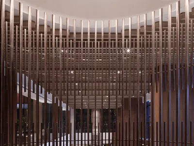 A modern restaurant interior with a mix of walnut and glass materials, featuring a central spiral staircase and a spacious di