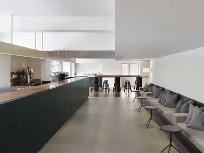 A modern cafe bar and restaurant with mixed-materials and sleek design.