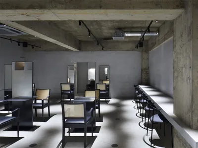 Concrete restaurant with industrial seating