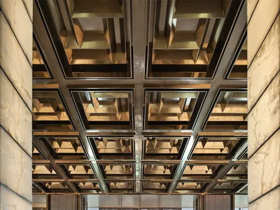 Modern hotel lobby featuring marble and concrete materials