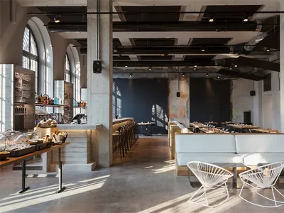 Industrial-style restaurant interior with concrete flooring, wooden benches, and metal accents.