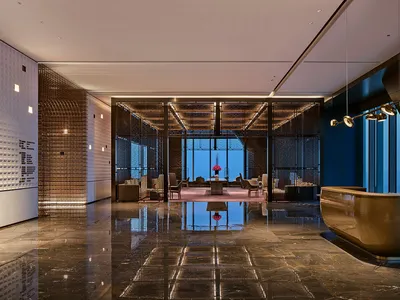 Modern hotel reception area with marble and glass materials