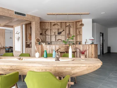 A modern restaurant bar interior with wooden elements and stylish decor.