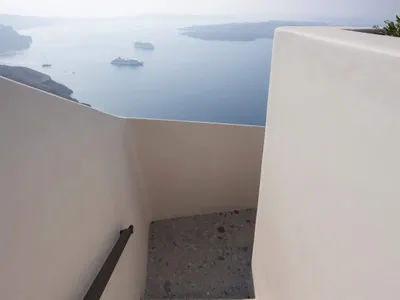 Marble staircase with a view of the sea.