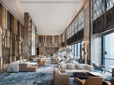Modern hotel lobby featuring marble and concrete materials