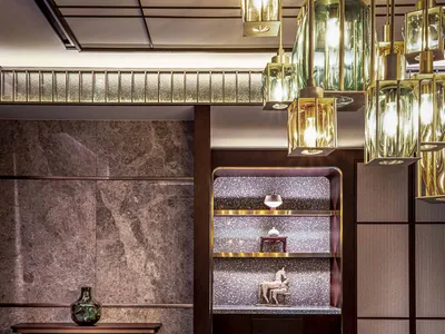 Modern restaurant interior with glass, marble, and wooden elements