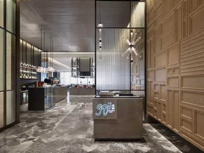 Modern restaurant interior with marble flooring and wood panel walls