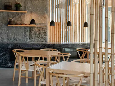 Modern restaurant interior with bamboo ceiling and lighting fixtures