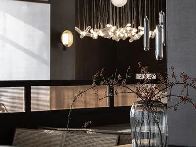 Contemporary restaurant interior featuring glass lighting fixtures