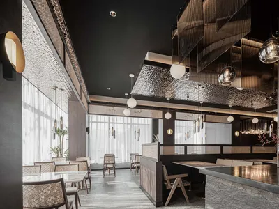 A modern restaurant interior featuring a textured metallic ceiling and glass chandelier fixtures.